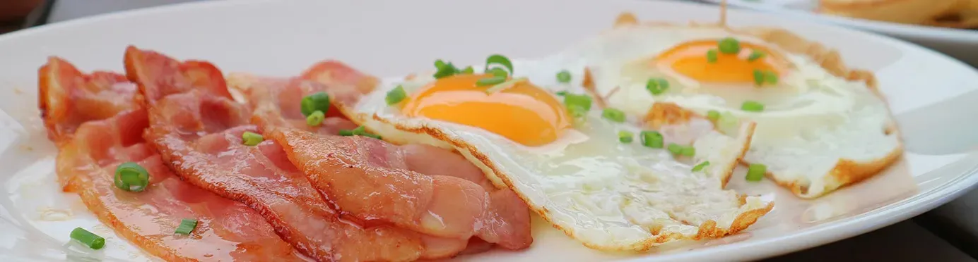 Plate of bacon and fried eggs from the Grand Bonjour breakfast